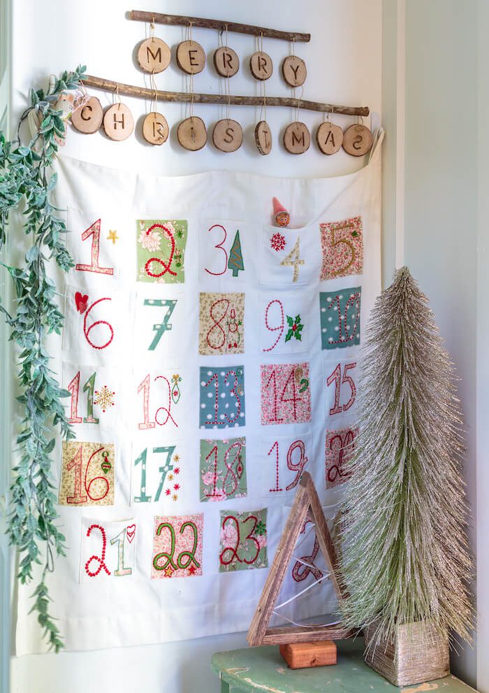 Hanging advent calendar with Merry Christmas wood sign.