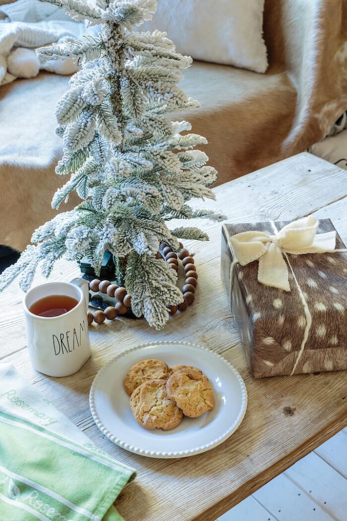 Woodland Christmas theme coffee table with cookies and a small Christmas tree.