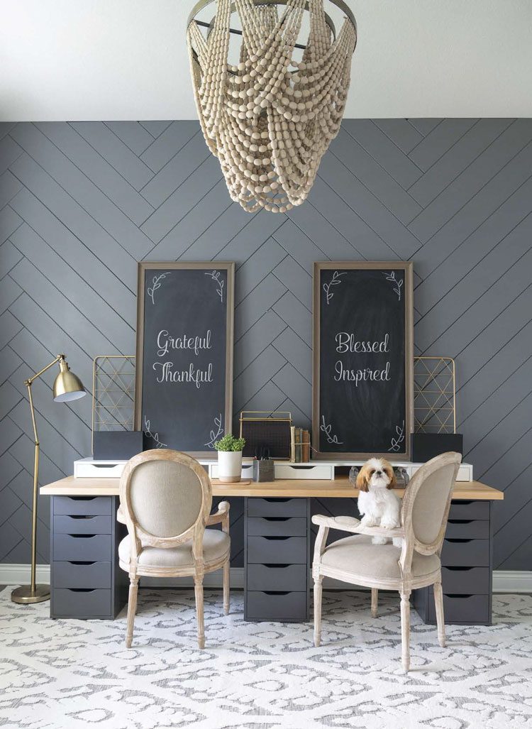 This Texas farmhouse office space has a dark gray zig-zag shiplap wall and two chalkboard signs with cursive script.