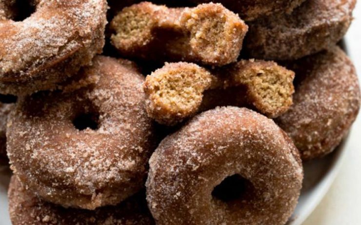 This one puts the thanks in Thanksgiving recipes—it's an apple cider doughnuts covered in sugar, piled on top of a plate.