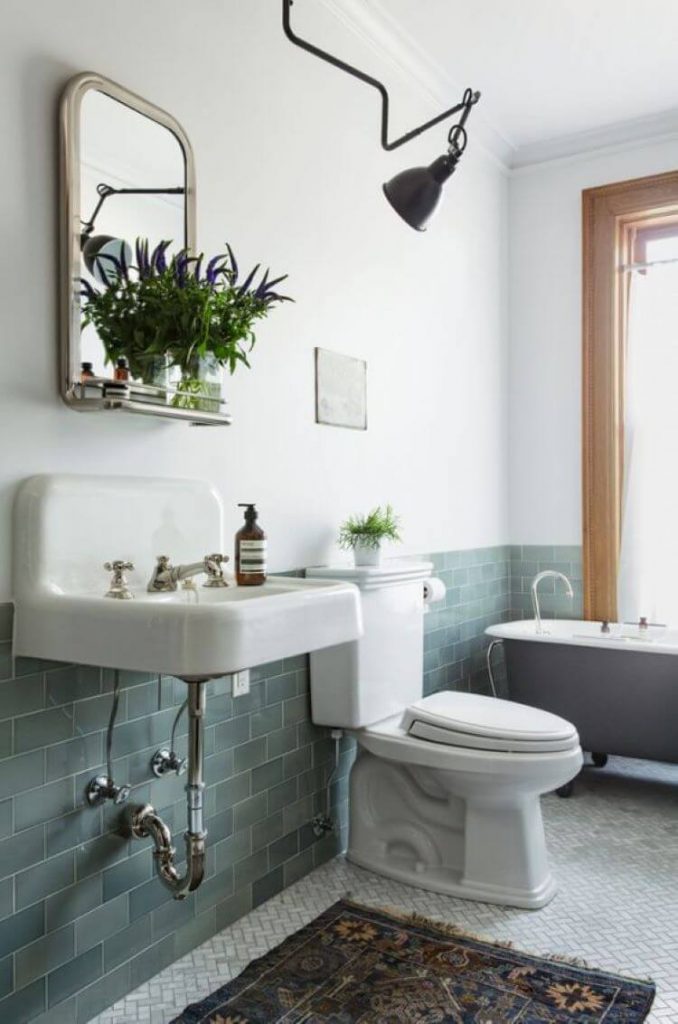 bathroom with dark green wainscoting