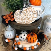 This rustic wood, circular, two-tiered tray stand is perfect for farmhouse Halloween parties.
