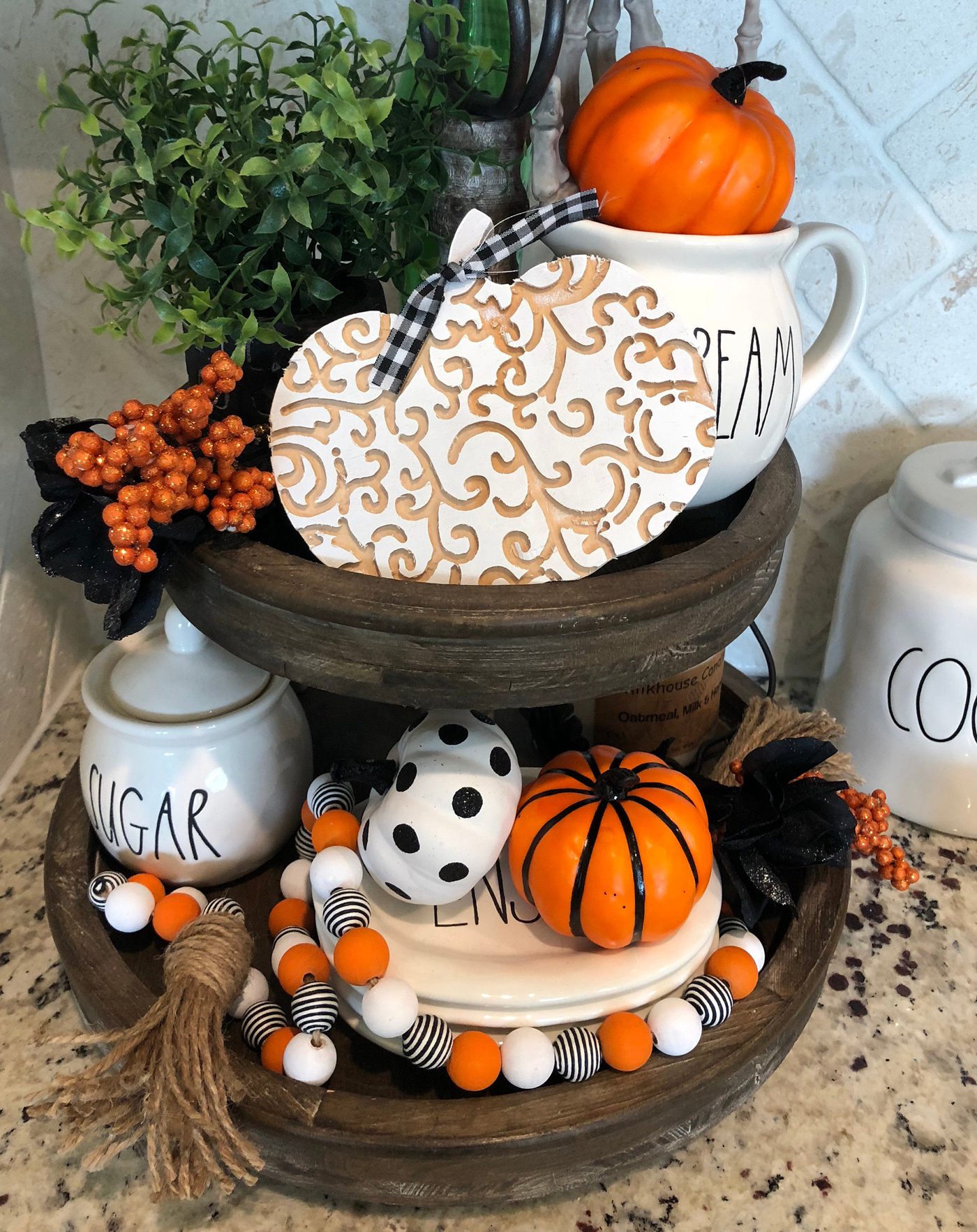 This rustic wood, circular, two-tiered tray stand is perfect for farmhouse Halloween parties.