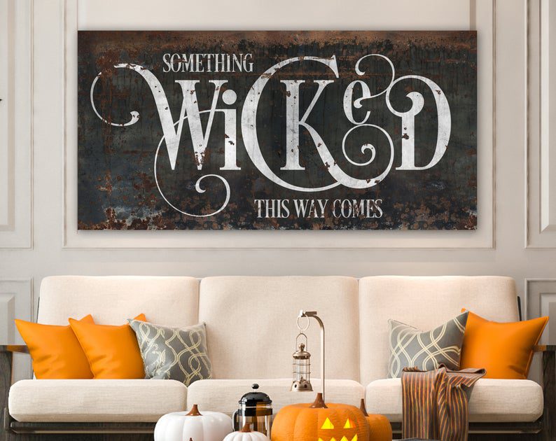 A size-customizable canvas with a rusted metal background printed on it with the words "Something Wicked This Way Comes" is perfect for a farmhouse Halloween.