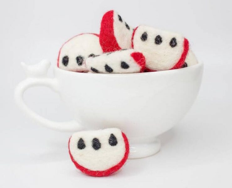 Tea cup filled with felt apple slices