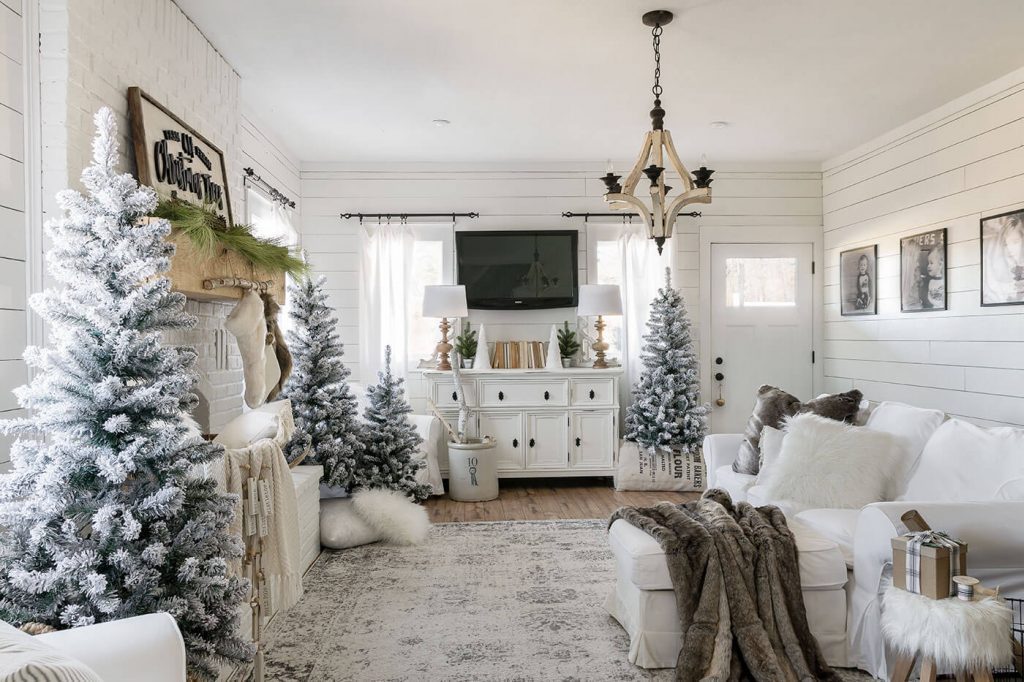 Living room with decorate with Christmas trees around the room