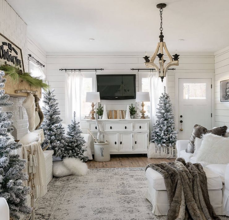 Living room with decorate with Christmas trees around the room