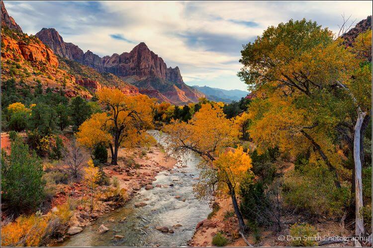 Canyon mounts with river and yellow trees