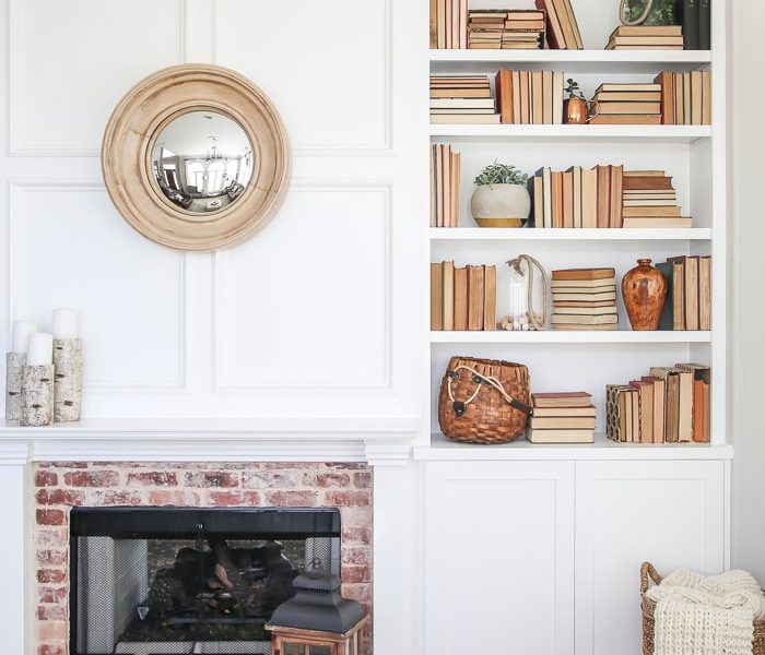 Bookshelf with backward-facing books in living room, from Maison de Pax