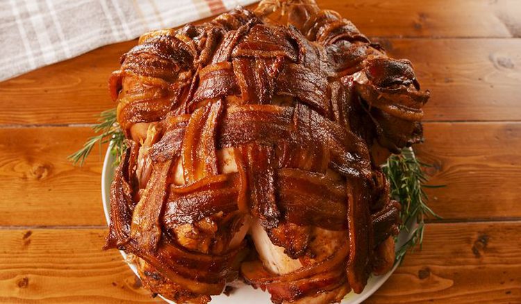 This Thanksgiving recipe is a traditional turkey wrapped with bacon in an over-and-under woven fashion.