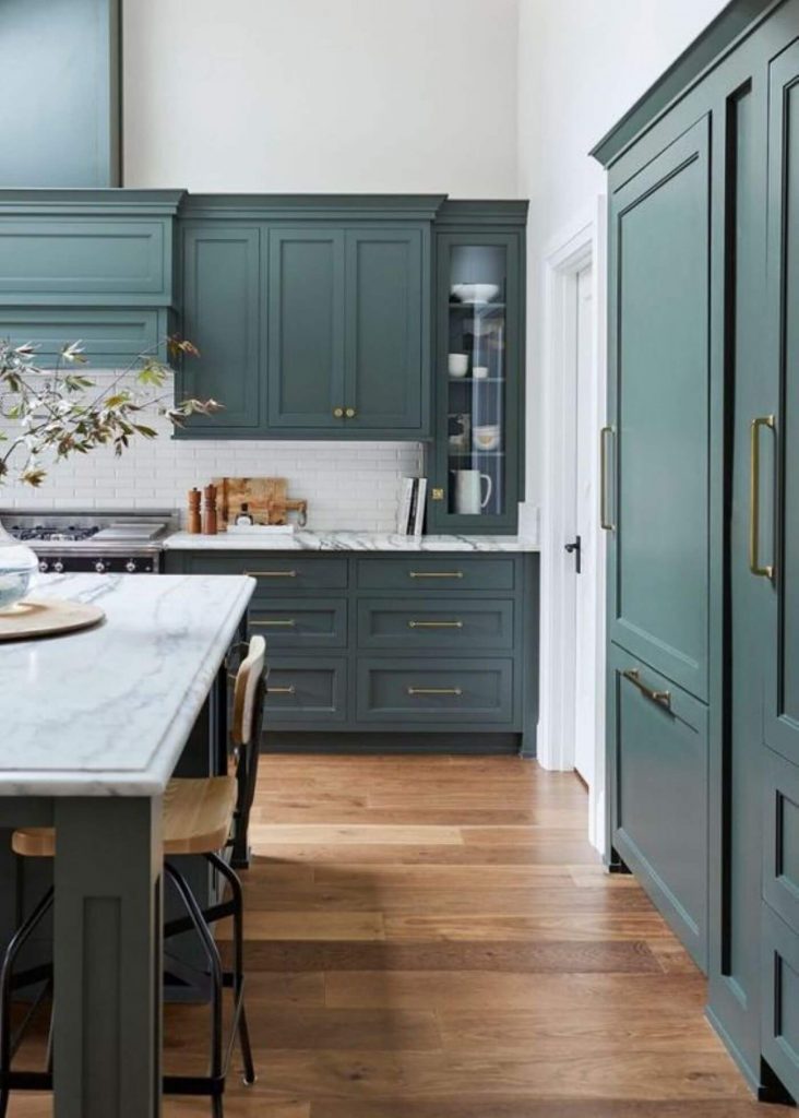 kitchen with dark blue-green cabinets