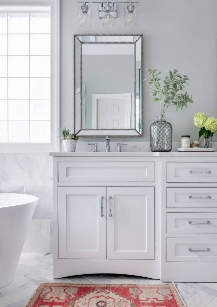 white cabinetry with marble floor