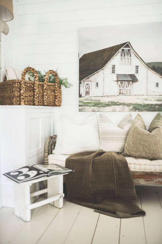 Cozy white room with barn painting on the wall