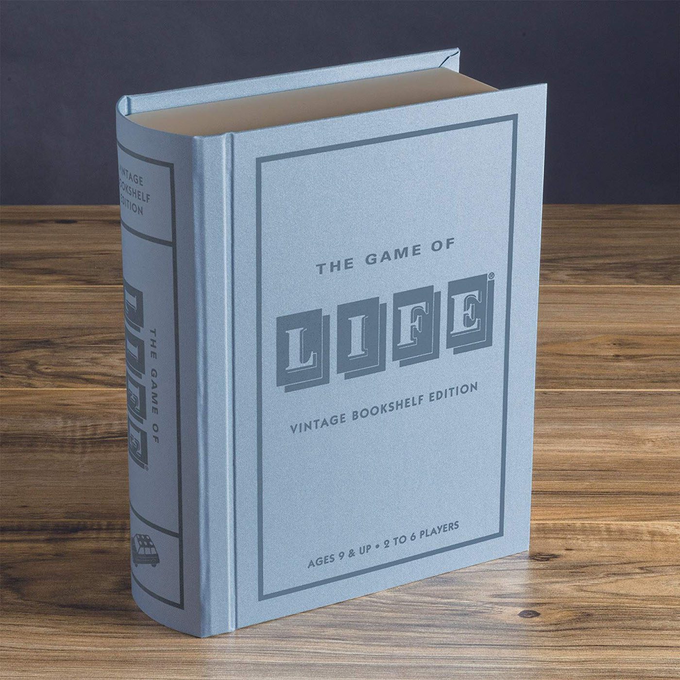 The Game of Life disguised as a light blue, vintage book.