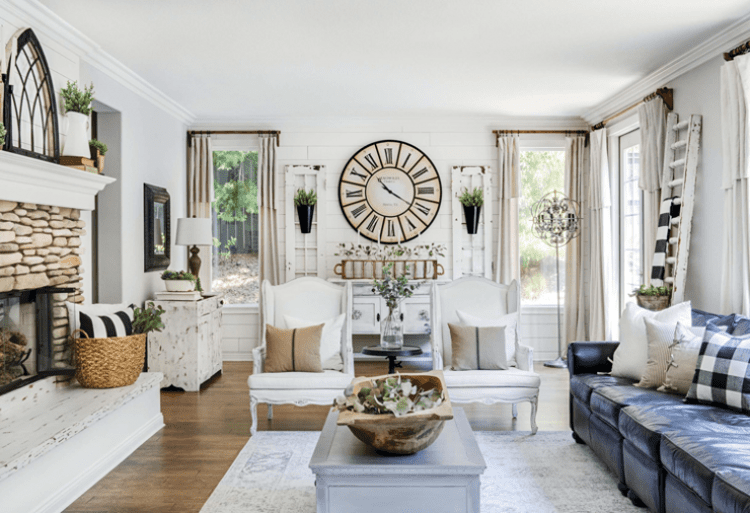 This modern farmhouse room shows us how to decorate with primarily white, navy and neutral colors.