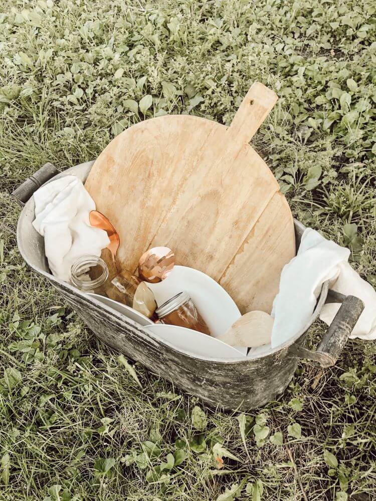 Bin full of dishes from the outdoor fall dinner