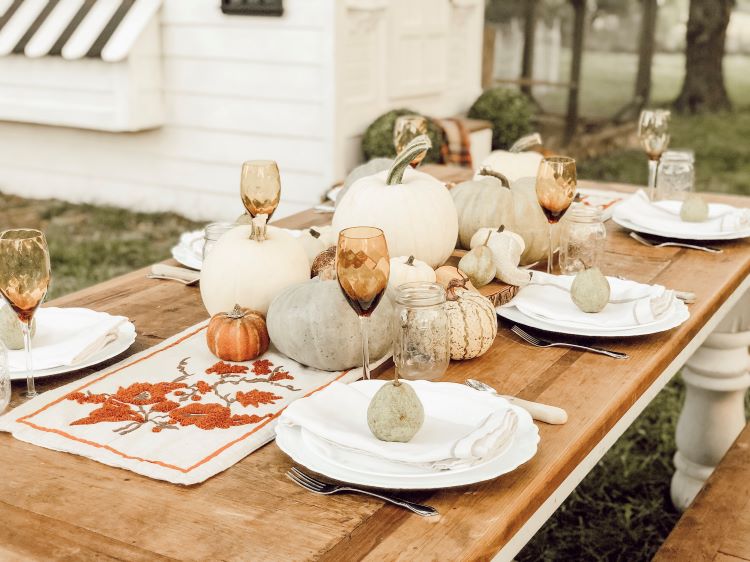 Outdoor fall dinner with pumpkins