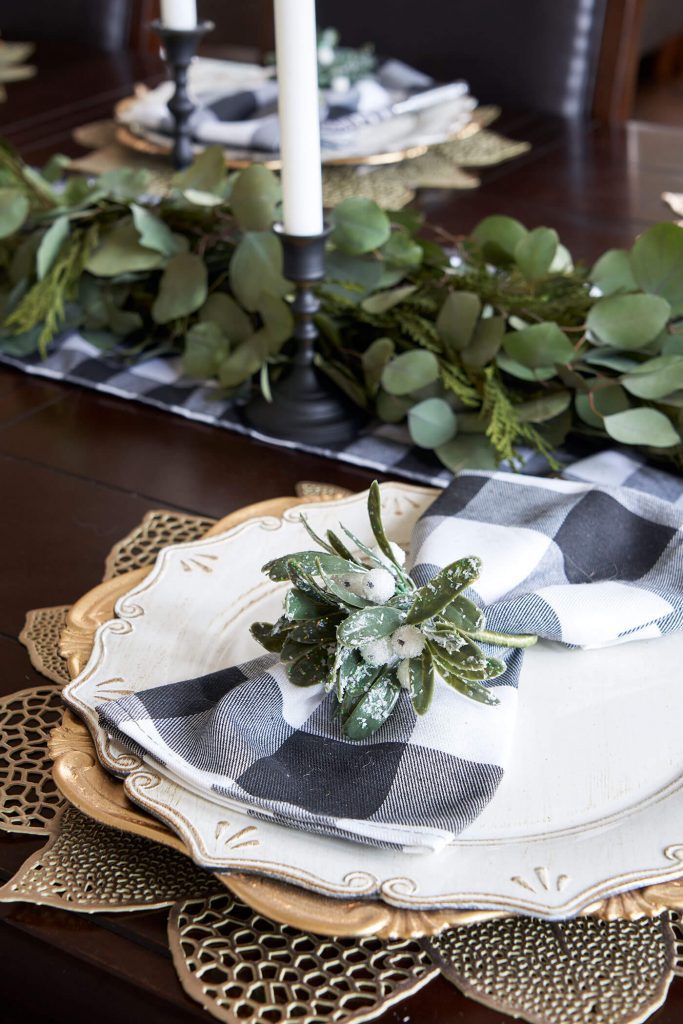 hosting a party table with green garland and green place setting
