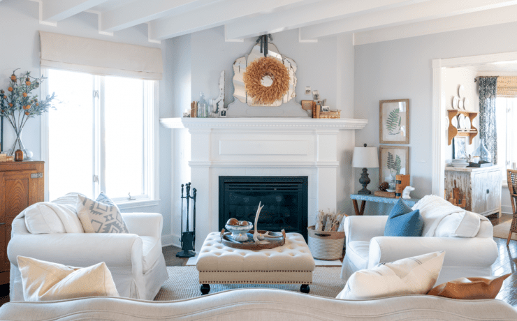 Modern farmhouse living with white walls and fireplace, a look that has been deep cleaned.