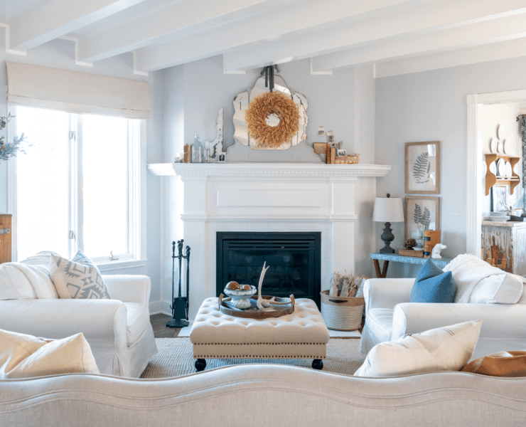 Modern farmhouse living with white walls and fireplace, a look that has been deep cleaned.