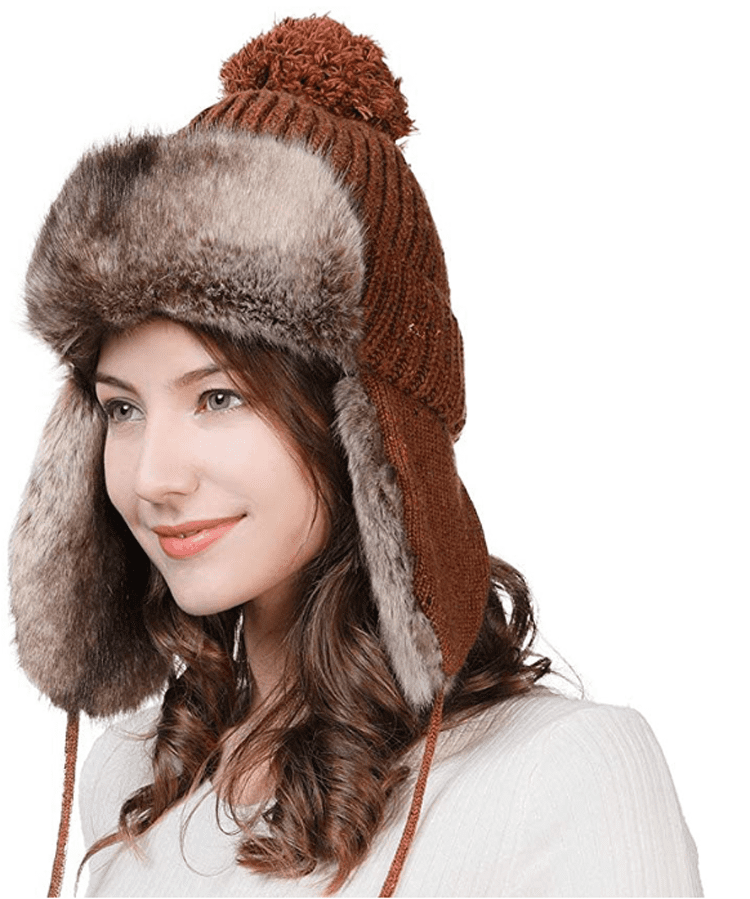 In rustic farmhouse fashion, this trapper hat has a short but thick faux fur lining, a rust-colored knit top and large ear flaps.