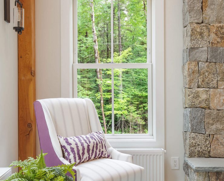 Accent chair in front of windows for farmhouse style