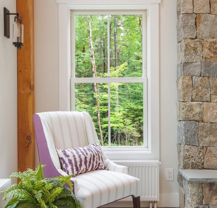 Accent chair in front of windows for farmhouse style