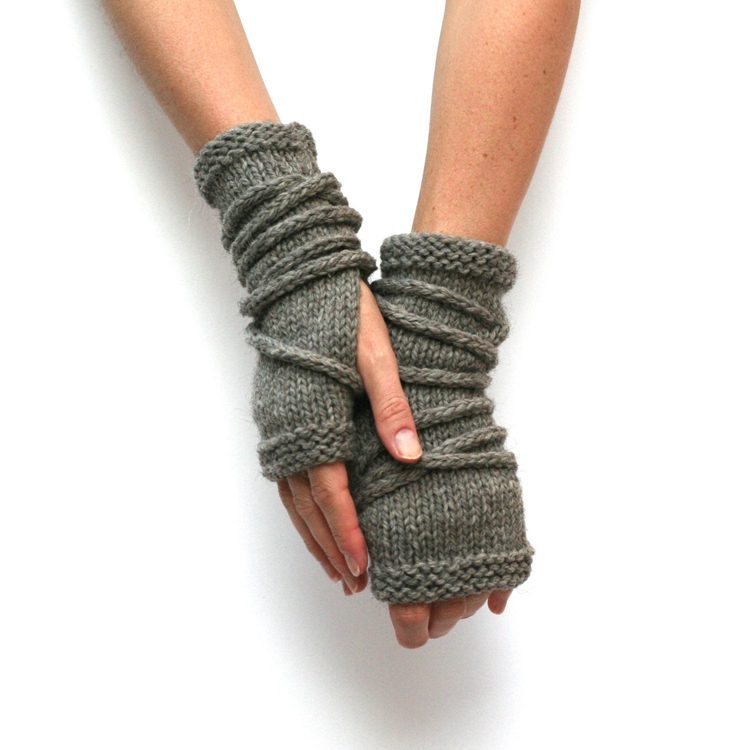 These olive-green fingerless gloves stop right past the knuckles and have yarn wrapped around them randomly in primitive farmhouse fashion.