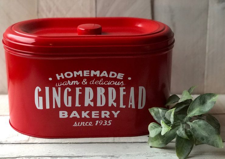 A vintage-inspired "homemade gingerbread bakery" red cookie tin, a truly unique piece of farm-fresh Christmas decor.