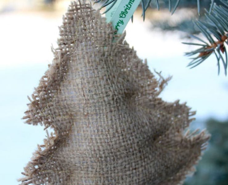 Burlap ornament in the shape of a tree, stuffed with cotton to make it three-dimensional.