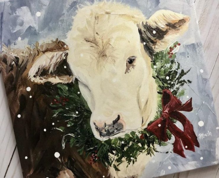 A cow with a Christmas wreath and ribbon is depicted in this painting