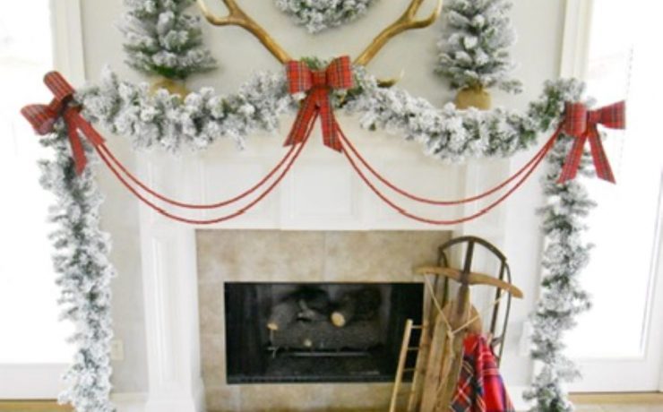 Red ribbons and bows complete the Christmas mantelpiece