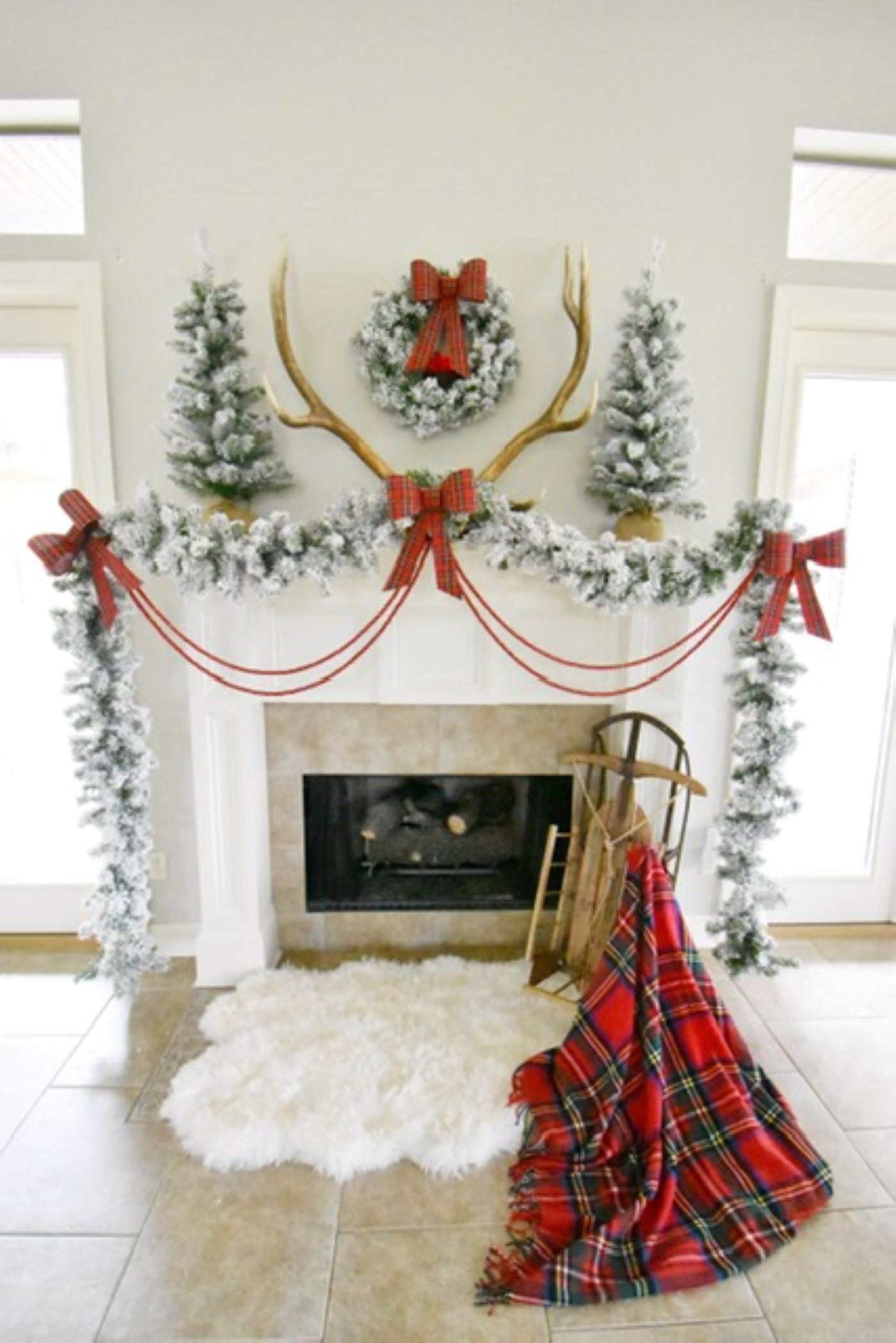 Red ribbons and bows complete the Christmas mantelpiece