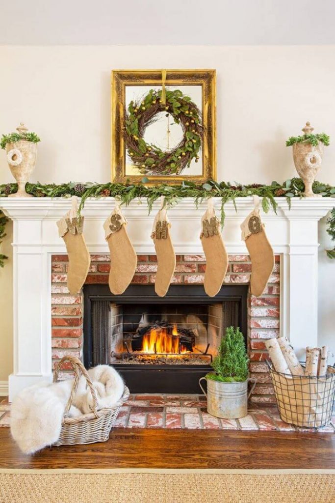 Farmhouse Christmas fireplace with stockings made with natural fibers