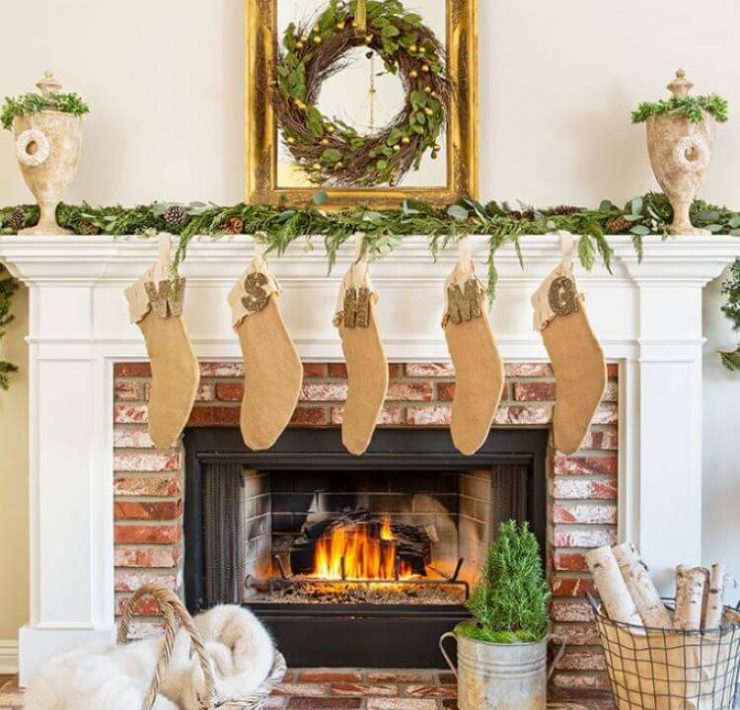 Farmhouse Christmas fireplace with stockings made with natural fibers