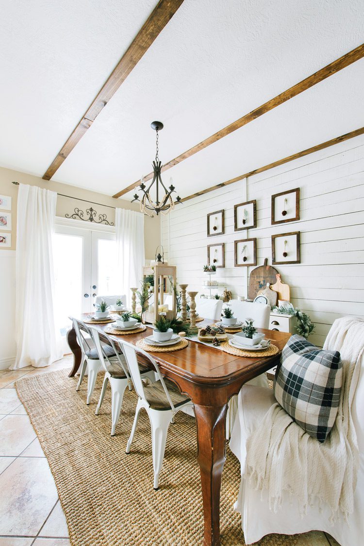 Utah farmhouse dinging room with three wood slats along the ceiling.