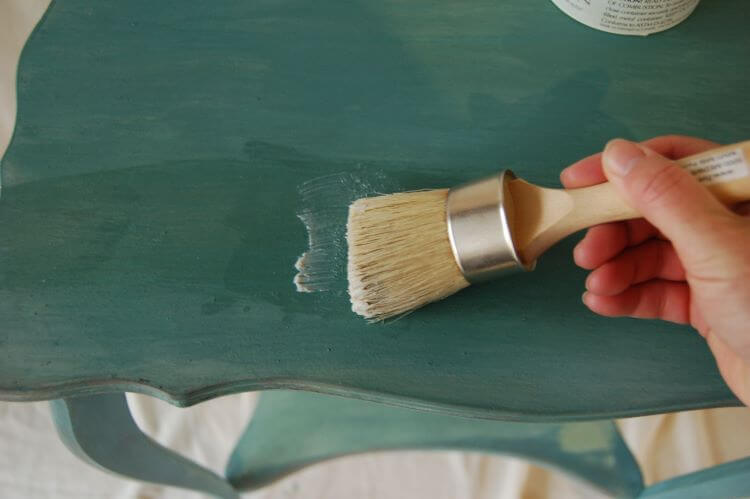 Apply a wax against furniture following the same direction it was painted