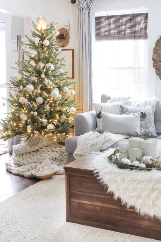 a cozy farmhouse living room with white furniture