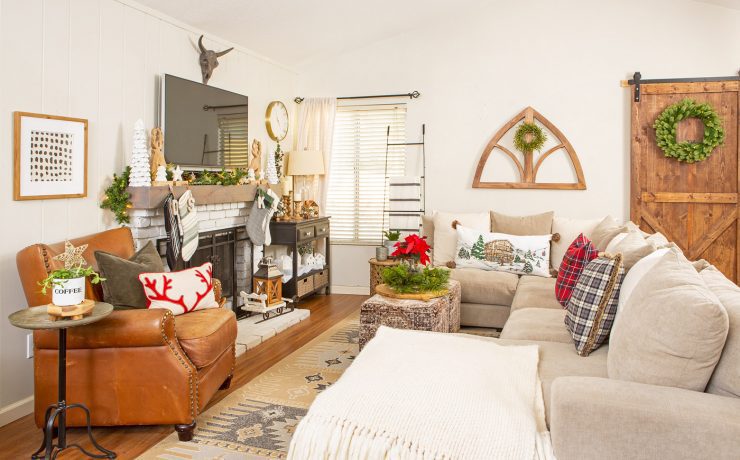 Christmas cabin family room with neutral furniture and decor.