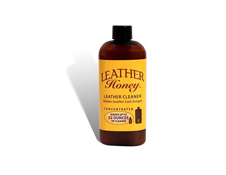 Brown bottle of leather cleaner with vintage-style yellow label.