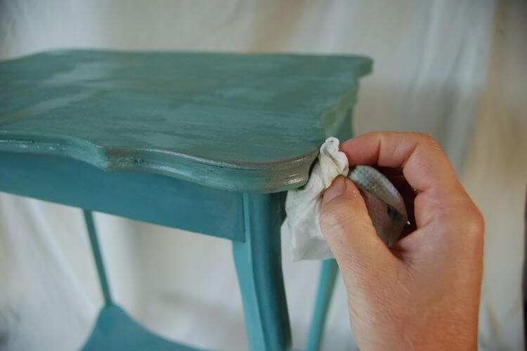 Apply wax to the tables edges in your milk paint DIY project