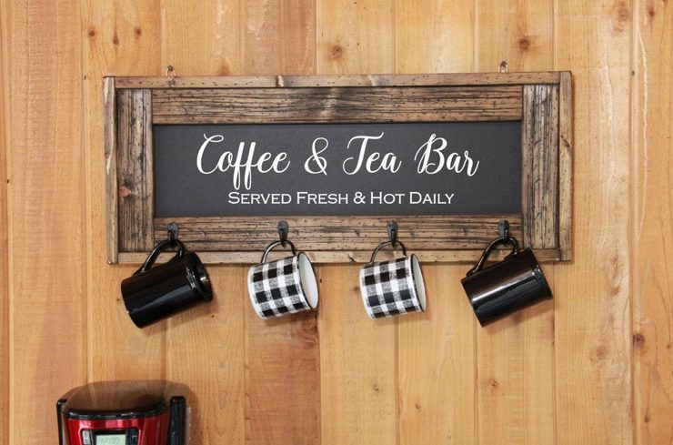 Wood-framed "Coffee and Tea Bar" sign with four hooks to hang mugs on, perfect for budget-friendly decor.