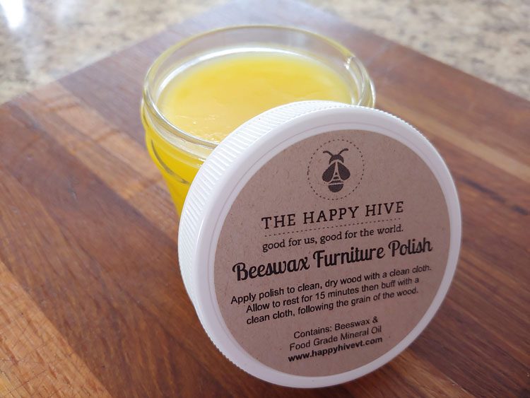 Jar of yellow beeswax furniture polish.