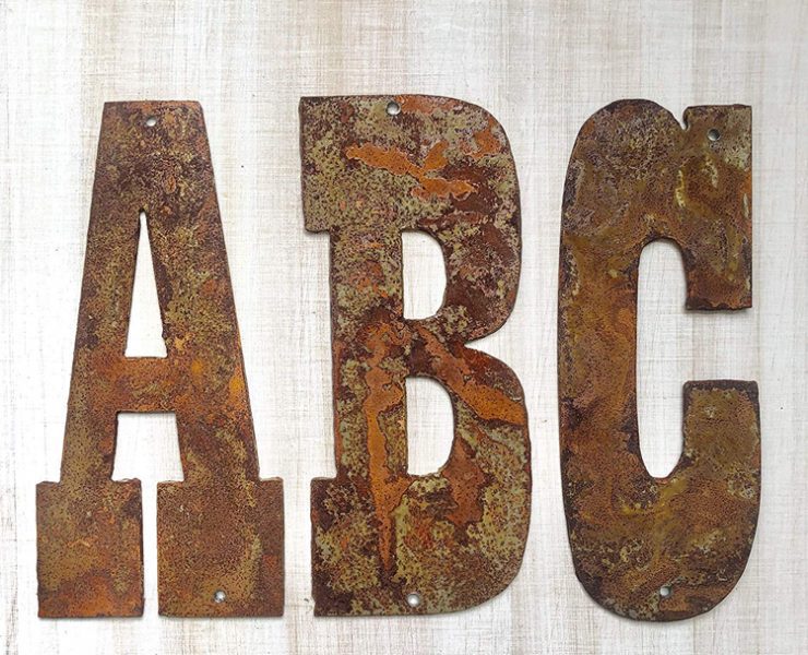 Small, rusted metal letters in cowboy font, great as budget-friendly decor.