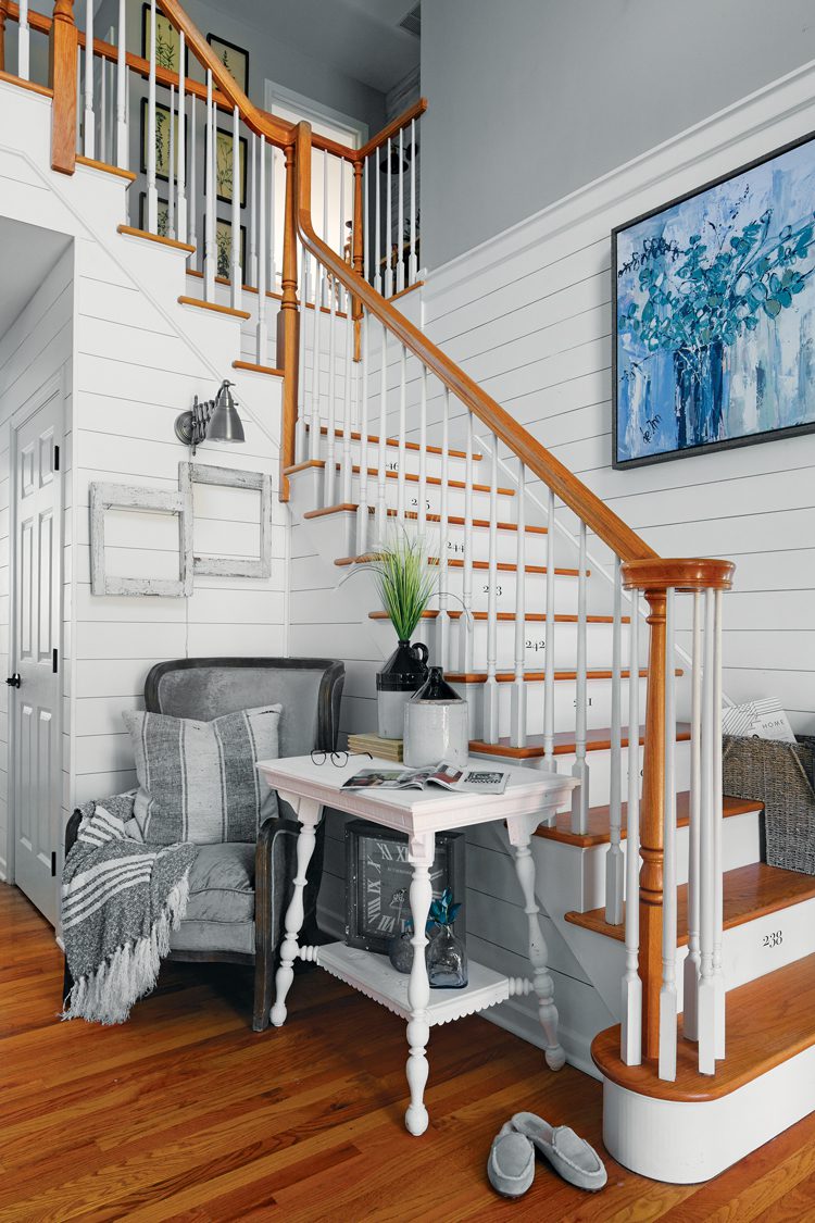 A white staircase with white shiplap