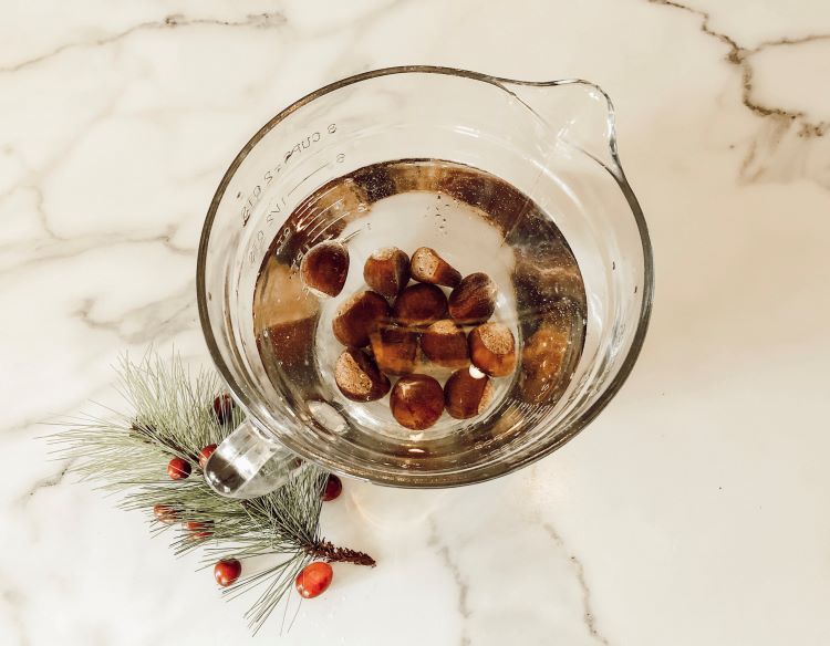 Roast chestnuts in a bowl filled with water