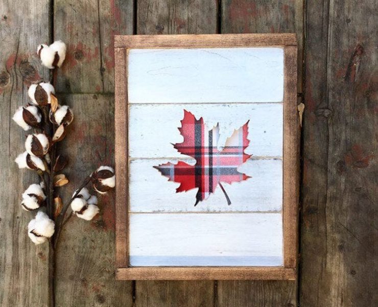 Wood framed plaid leaf silhouette with a white shiplap background, a beautiful plaid decor item.