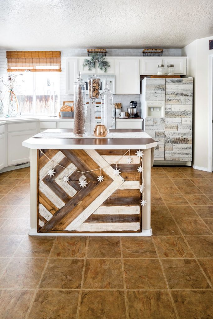 Rustic island in the kitchen with reclaimed wood siding
