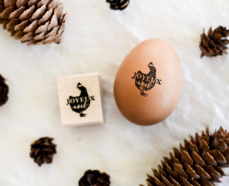 An egg with a stamp that reads Joyeux Noel