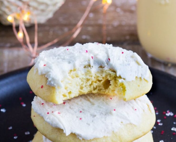 A stack of eggnog sugar cookies with rich buttercream icing